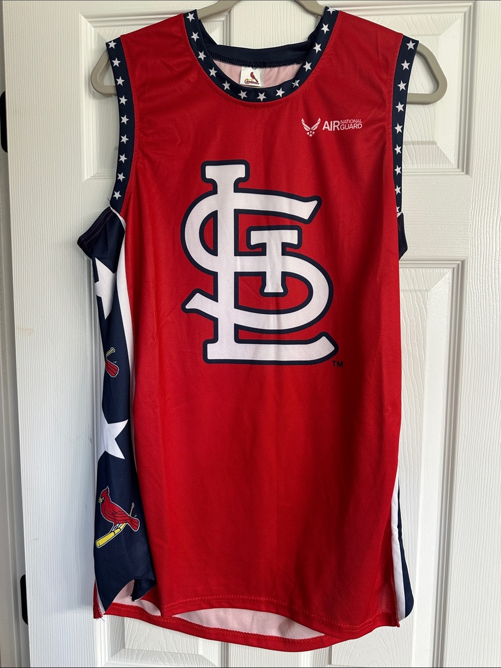 St. Louis Cardinals sleeveless jersey with national guard emblem.